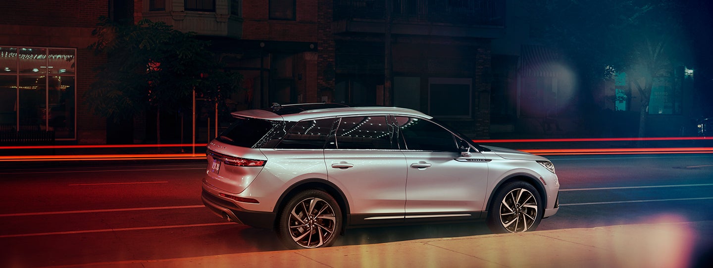 The 2024 Lincoln Corsair® SUV is parked on a city street at night. | Star Lincoln in Southfield MI